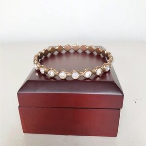 Gold Tone Metal Bangle with Faux Crystal